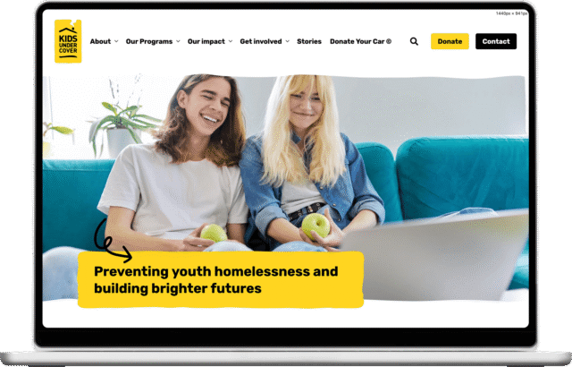 Kids Under Cover website shown on a laptop