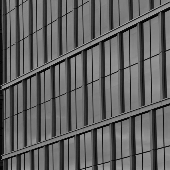 Reflective glass facade of a modern office building