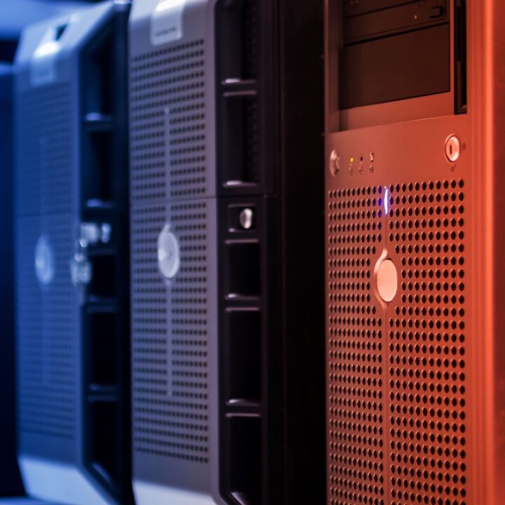 Blue and red-lit server towers in a data centre