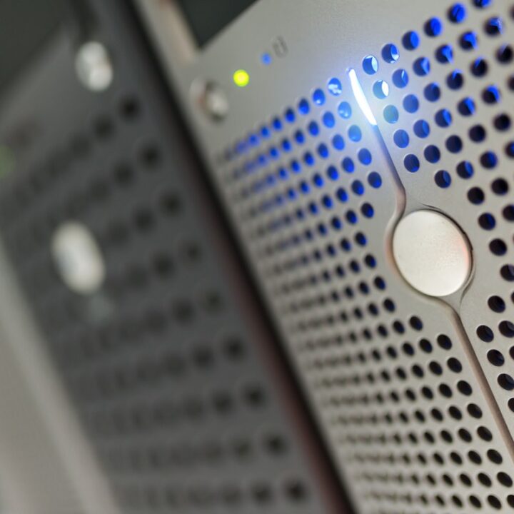 Blue indicator lights on a server rack in a data centre
