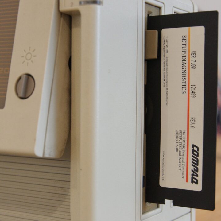 Vintage computer with a floppy disk in the drive