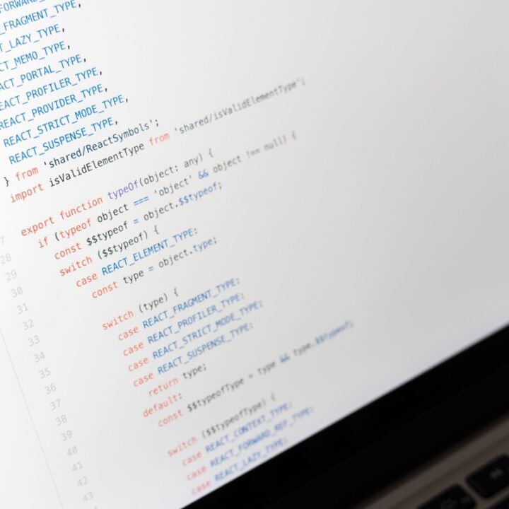 React code displayed on a laptop screen