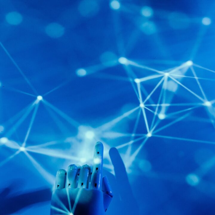 Robot hand interacting with a connected digital network