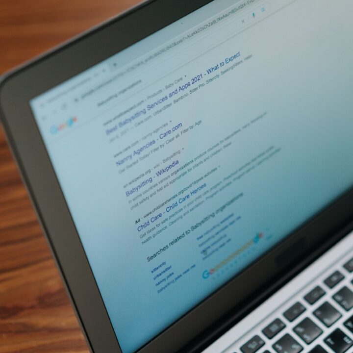 Web pages displayed in a browser on a laptop