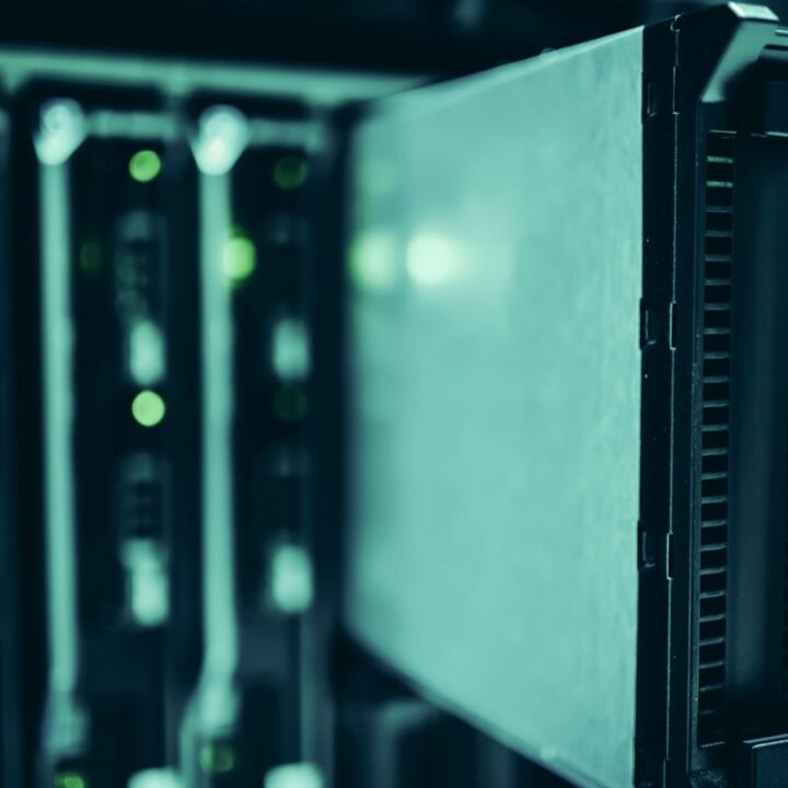 Blue-lit data centre server racks