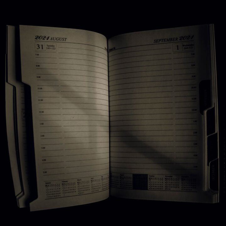 Open planner in a dark room